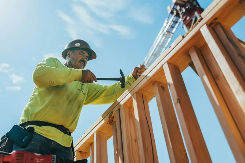 Builder working on a timber frame