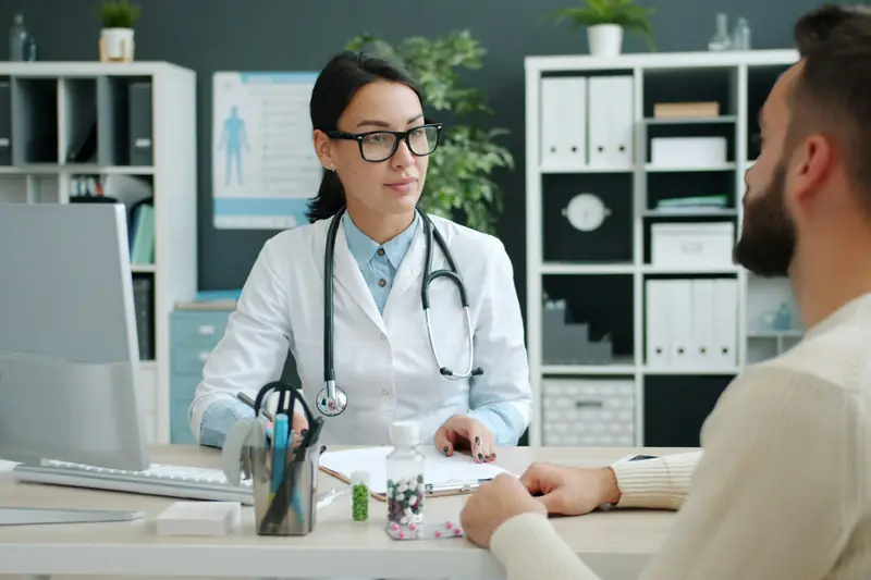 Doctor talking with a patient in a clinic