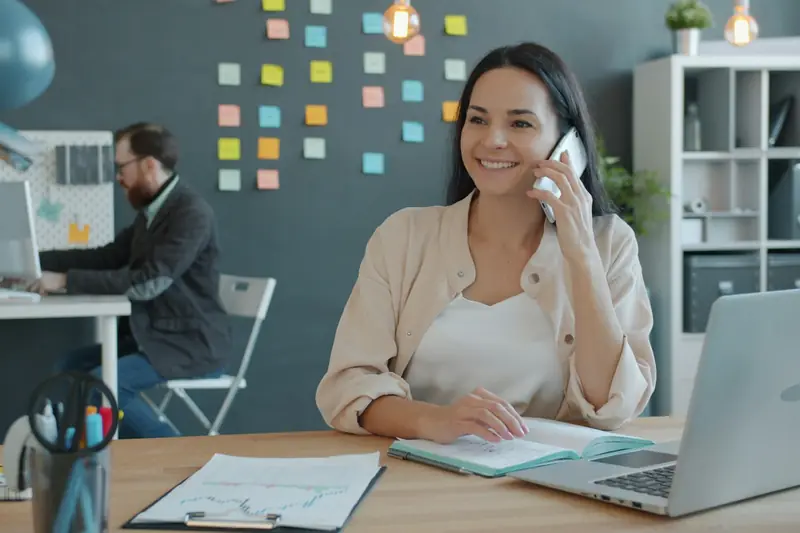 Professional on a phone call at her desk